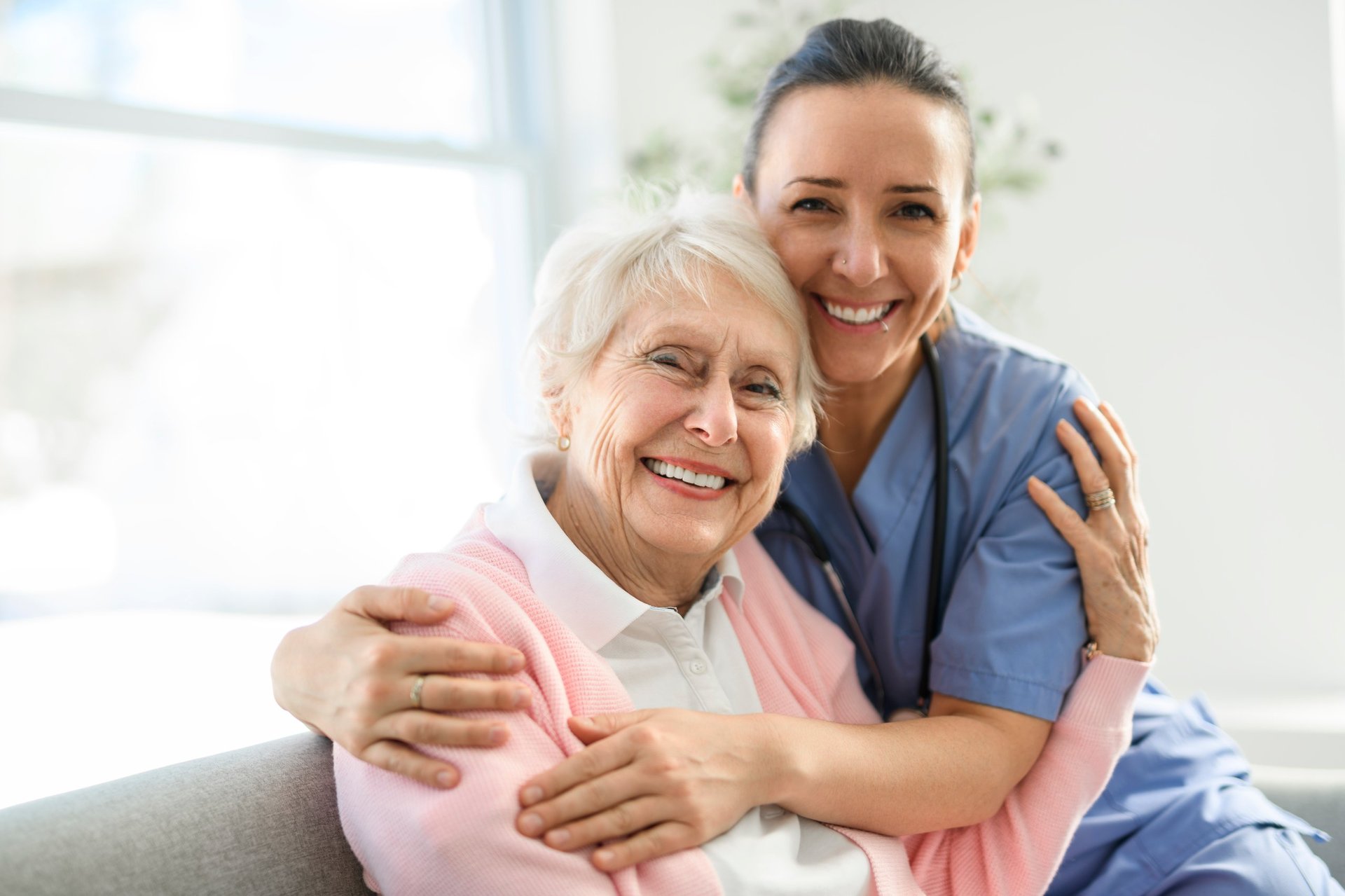 A portrait of a young nurse doctor with a senior patient at home during a consultation